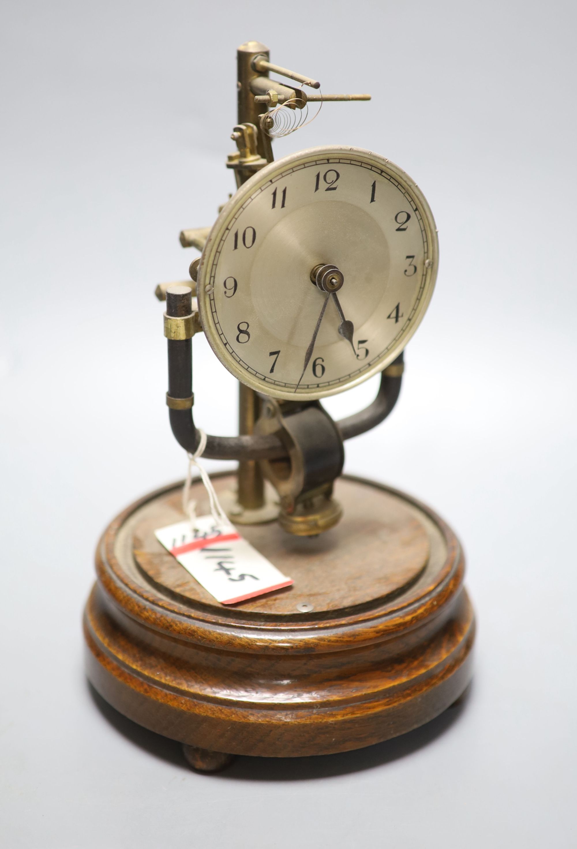 A Bulle type electric mantel timepiece under a dome, overall height 25cm